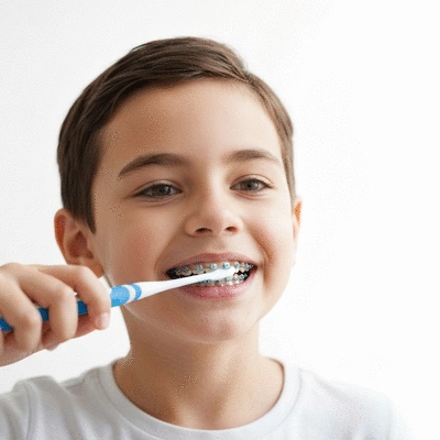 Child brushing teeth with braces, clear background