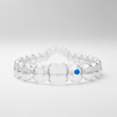 Invisalign Teen aligner with a small blue wear indicator